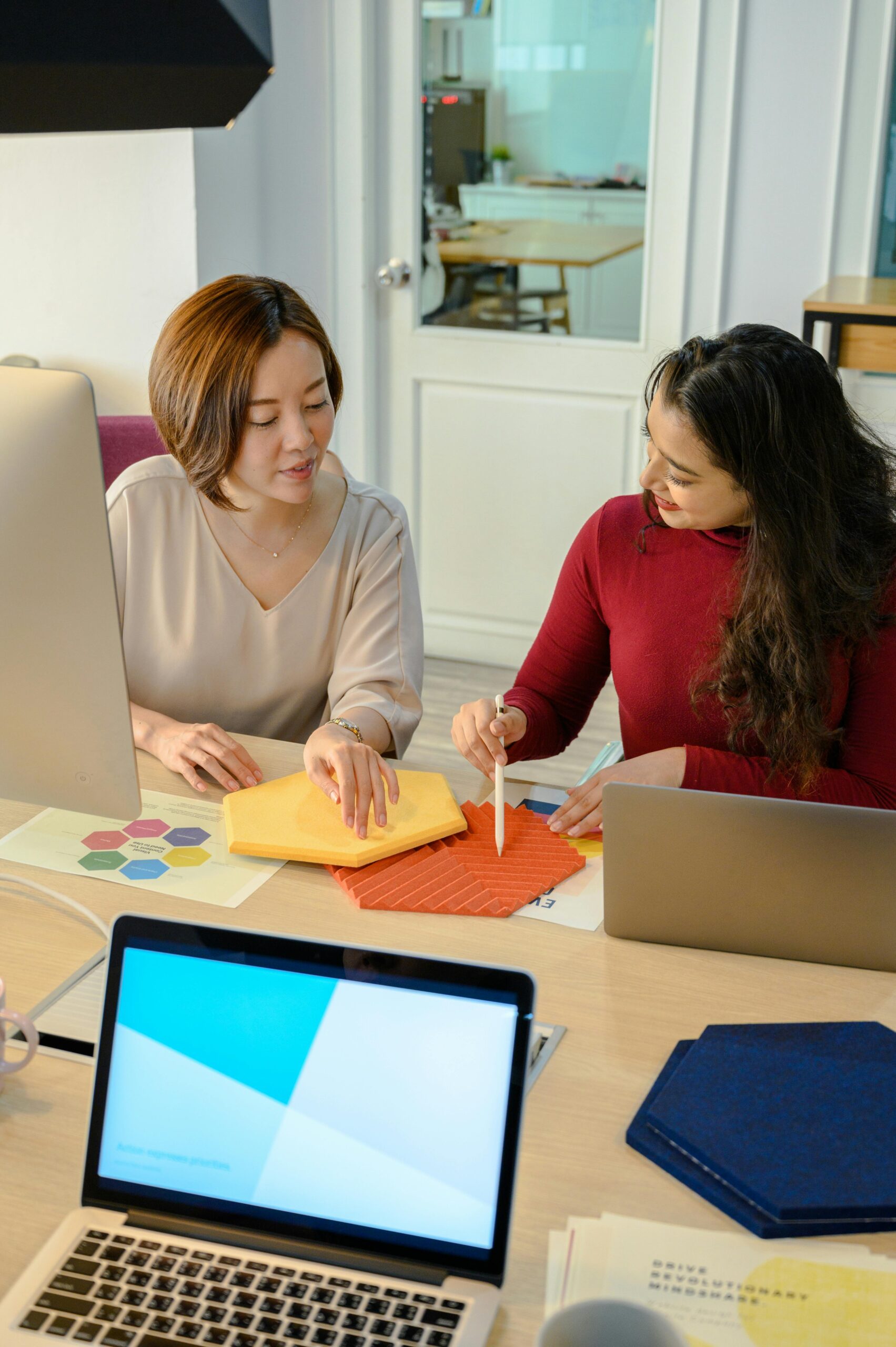 Picture of design team talking through colors at a desk.